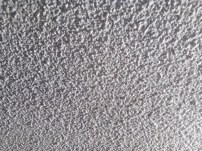 Close-up of a bumpy popcorn ceiling
